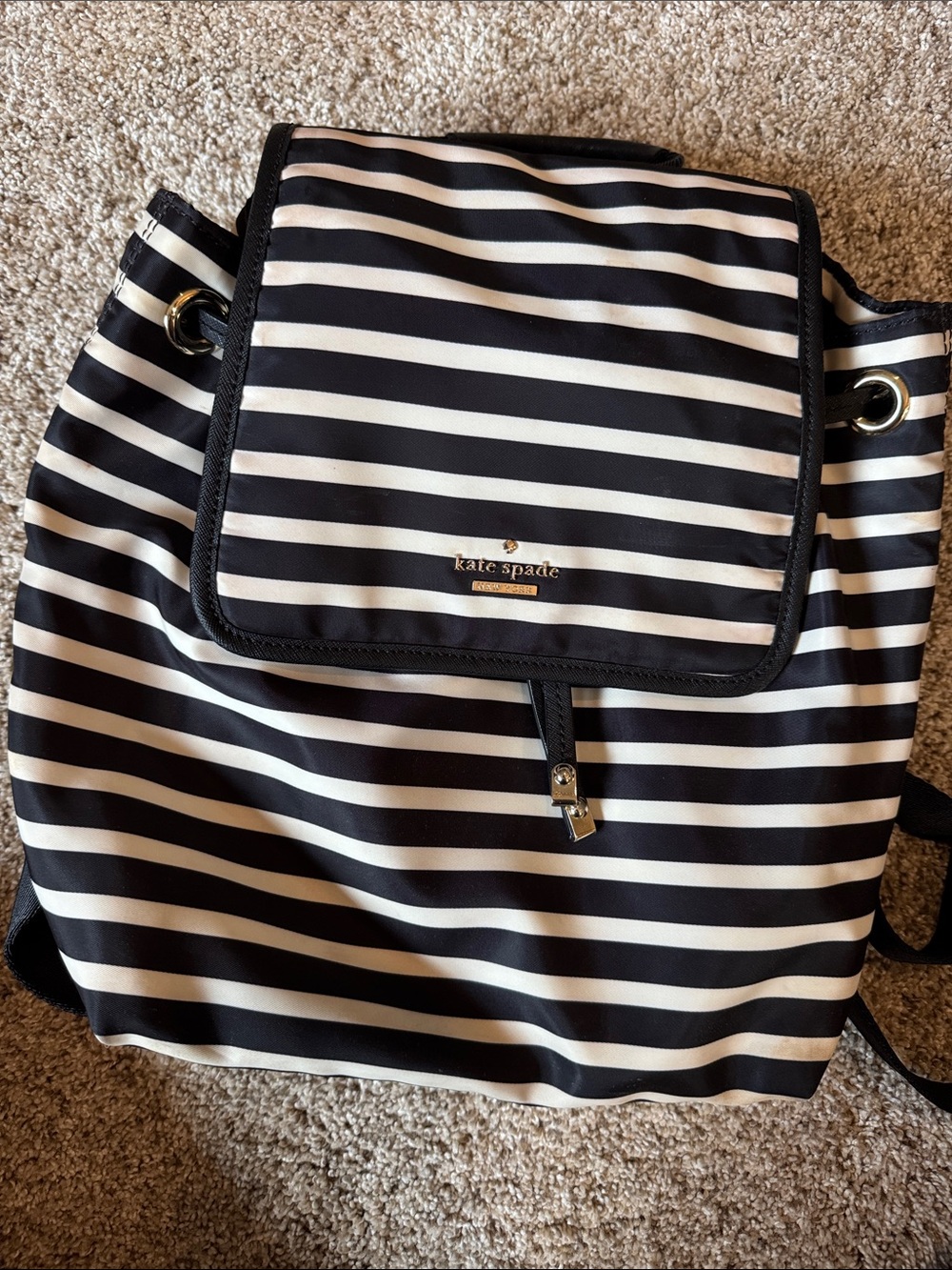 kate spade Black and White Striped Drawstring Flap Backpack